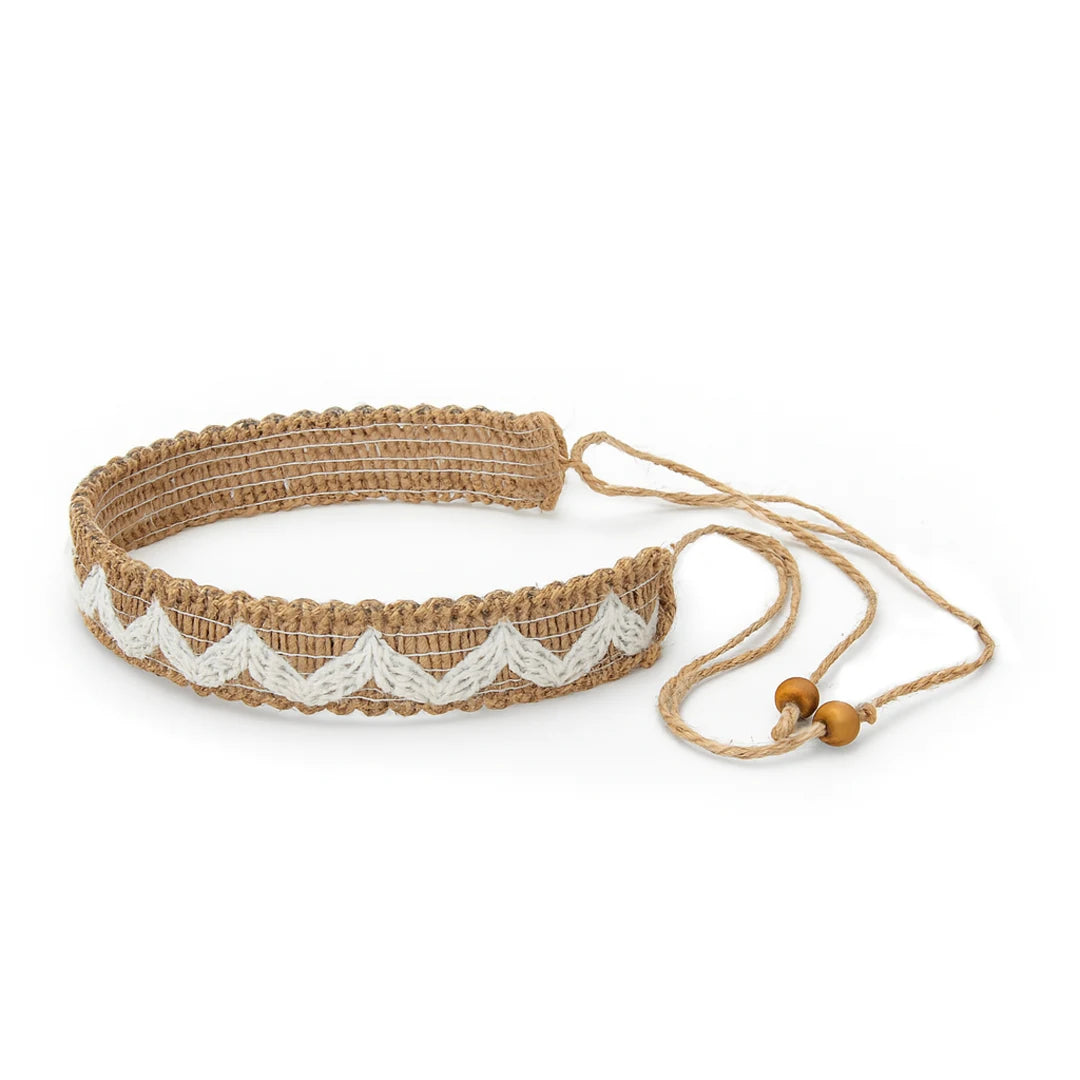 Musical score book open to pages of sheet music, with a cover featuring an 11-tone tongue drum.