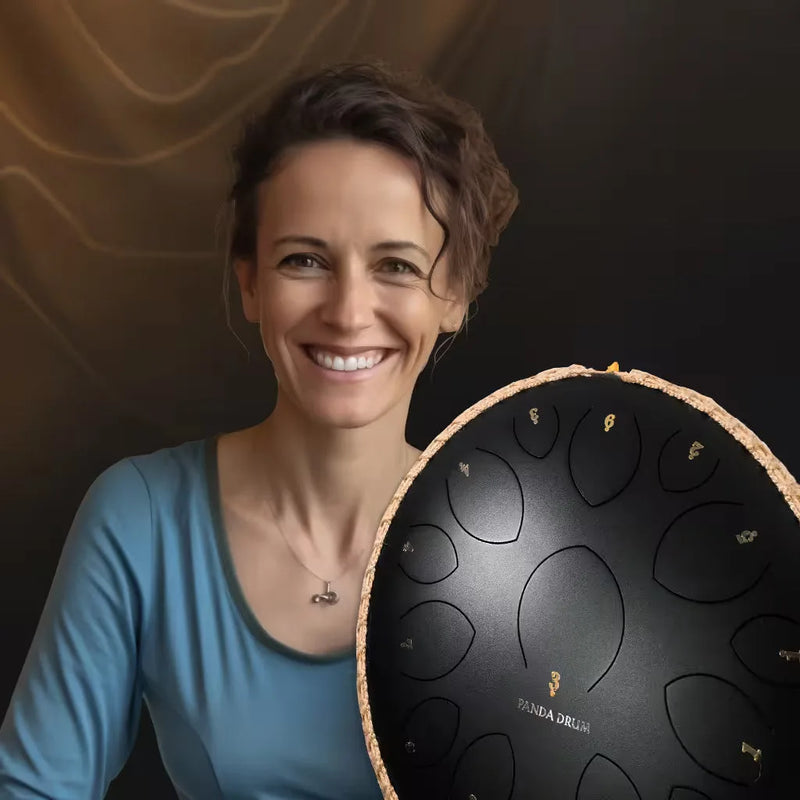 Woman holding a black Panda Drum Pro